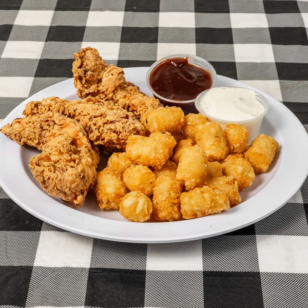 Fried chicken tenders and tater tots with barbecue and ranch dipping sauces on a white plate.